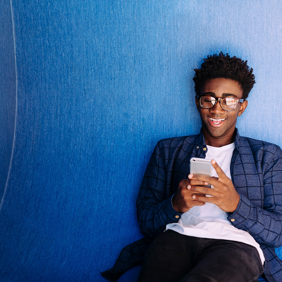Young man charging his phone